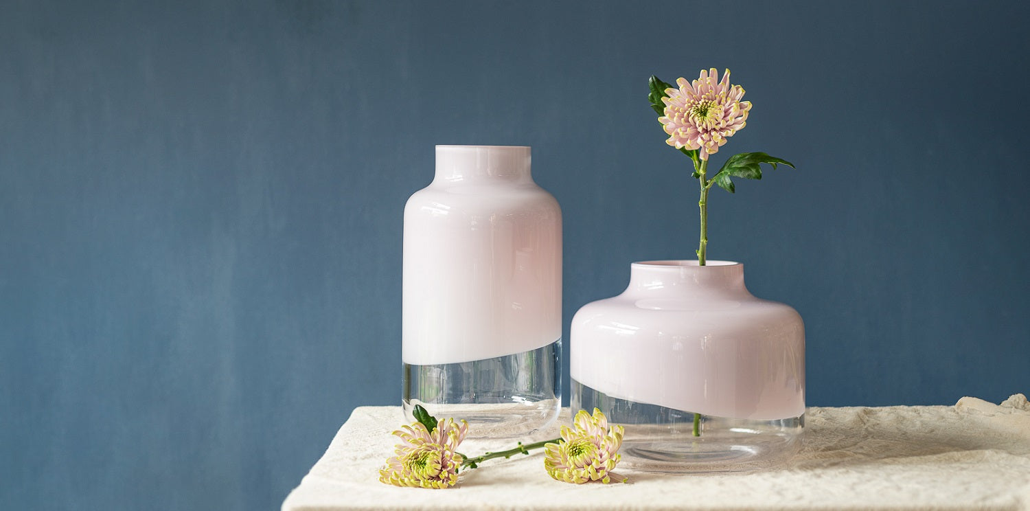 NUDE Magnolia vase in medium and large lead free crystal, presented with a single flower