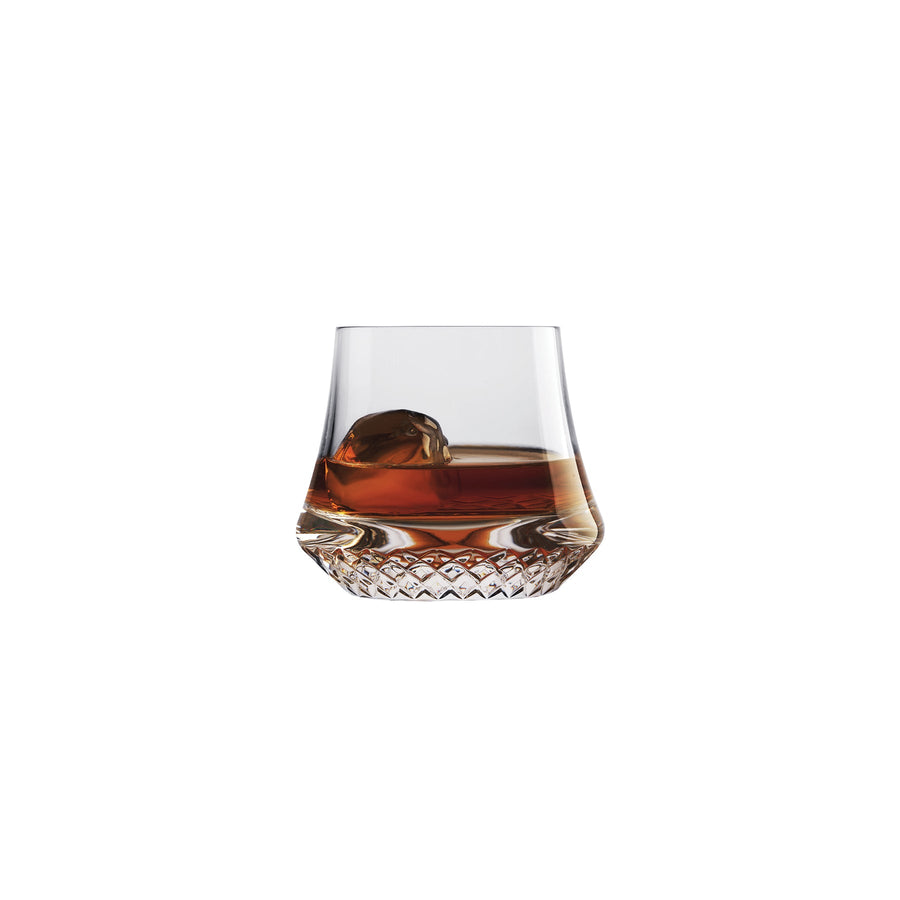 NUDE Paris whisky glass SOF, presented filled with whisky on a white background