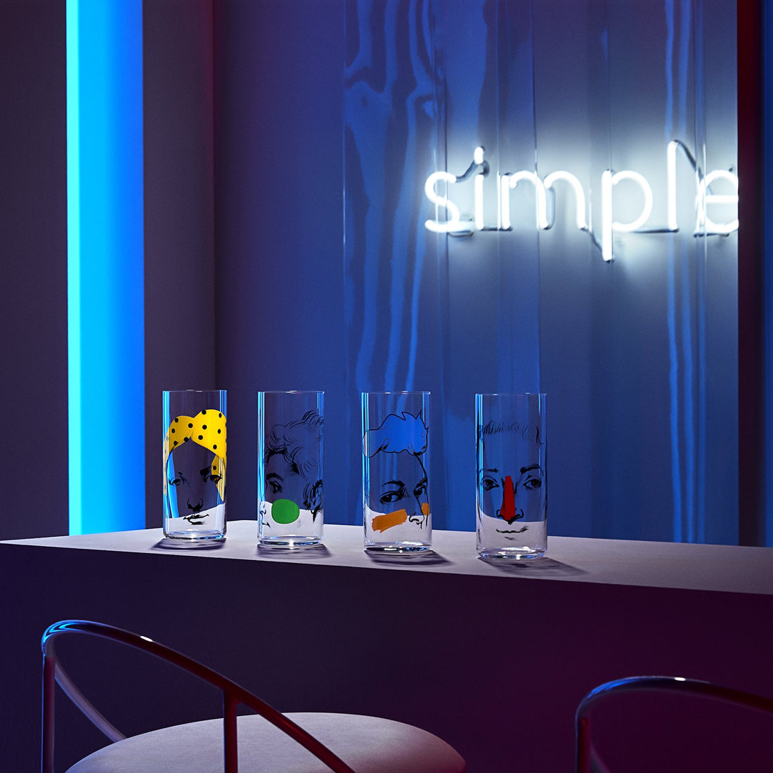 Lifestyle image of NUDE Rock & Pop high ball glasses in neon environment